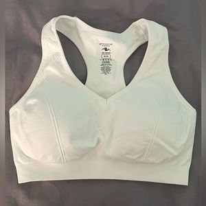 A white sports bra, soft and sturdy. Nearly worn